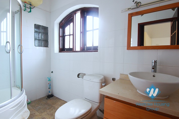 Unfurnished 4 bedrooms house with yard and garage for rent in Au Co st, Tay Ho area.