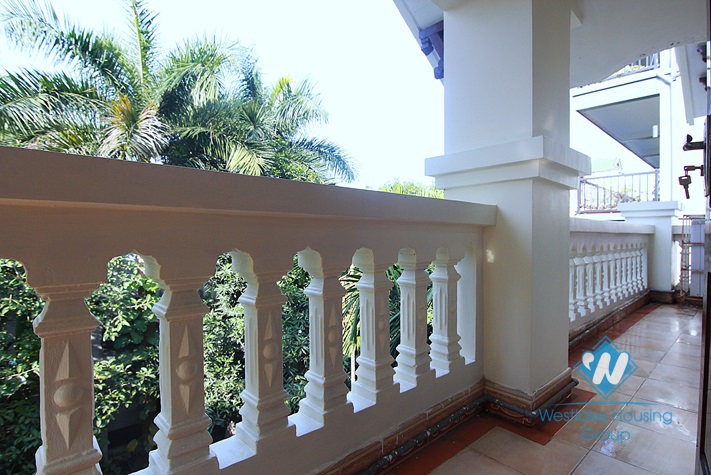 Unfurnished 4 bedrooms house with yard and garage for rent in Au Co st, Tay Ho area.