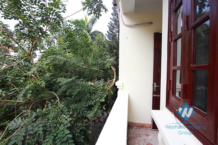 Unfurnished 4 bedrooms house with yard and garage for rent in Au Co st, Tay Ho area.