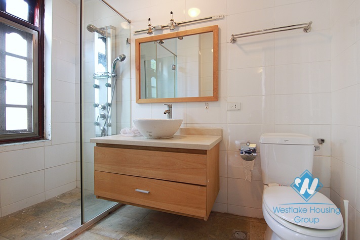 Unfurnished 4 bedrooms house with yard and garage for rent in Au Co st, Tay Ho area.