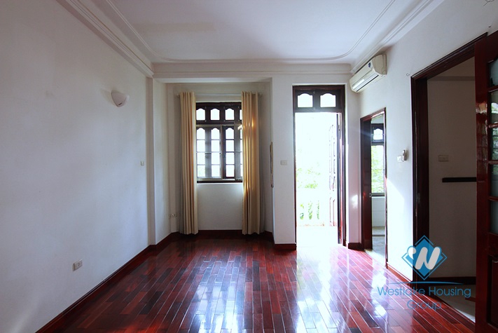 Unfurnished 4 bedrooms house with yard and garage for rent in Au Co st, Tay Ho area.