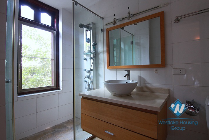 Unfurnished 4 bedrooms house with yard and garage for rent in Au Co st, Tay Ho area.