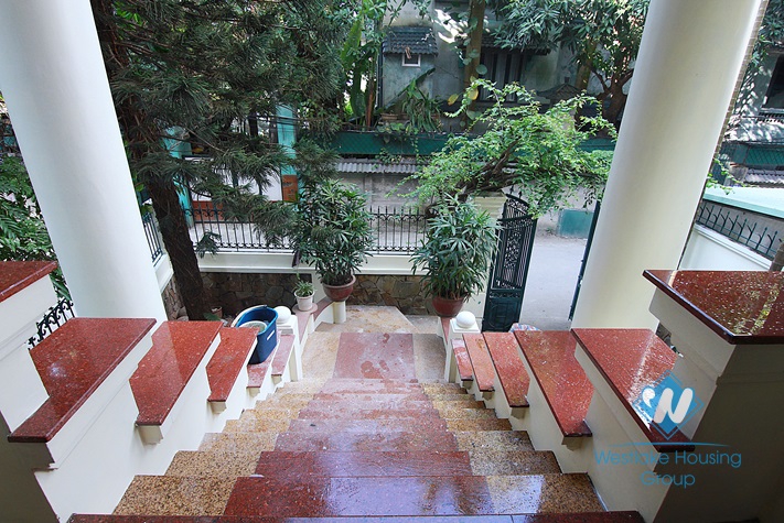 Unfurnished 4 bedrooms house with yard and garage for rent in Au Co st, Tay Ho area.