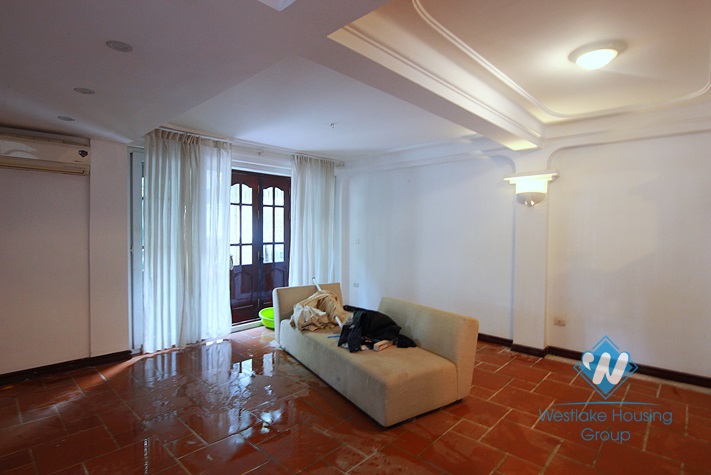 Unfurnished 4 bedrooms house with yard and garage for rent in Au Co st, Tay Ho area.