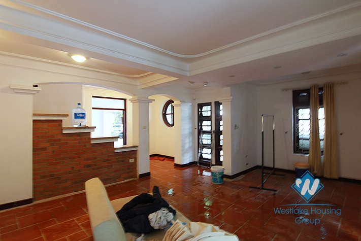 Unfurnished 4 bedrooms house with yard and garage for rent in Au Co st, Tay Ho area.