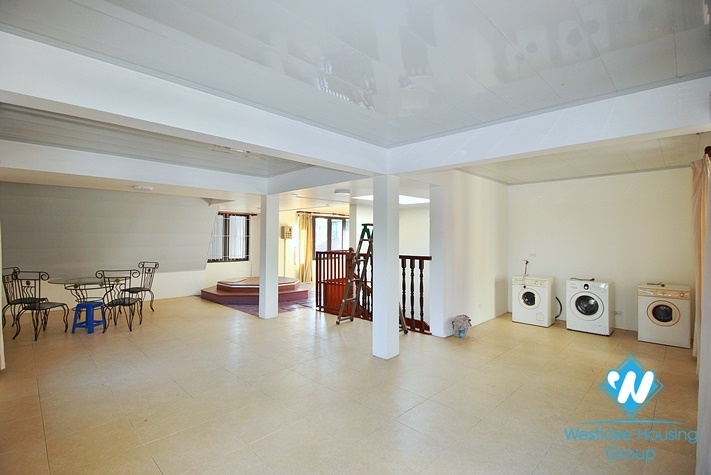 Charming house with nice design and big yard for rent in To Ngoc Van, Tay Ho, Ha Noi