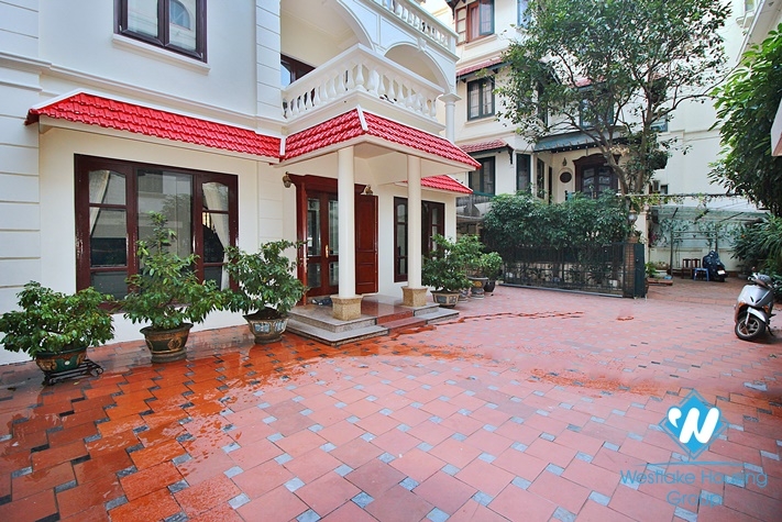 Charming house with nice design and big yard for rent in To Ngoc Van, Tay Ho, Ha Noi